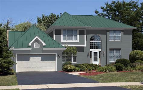 pics of houses painted green with metal green roof|green roof with grey siding.